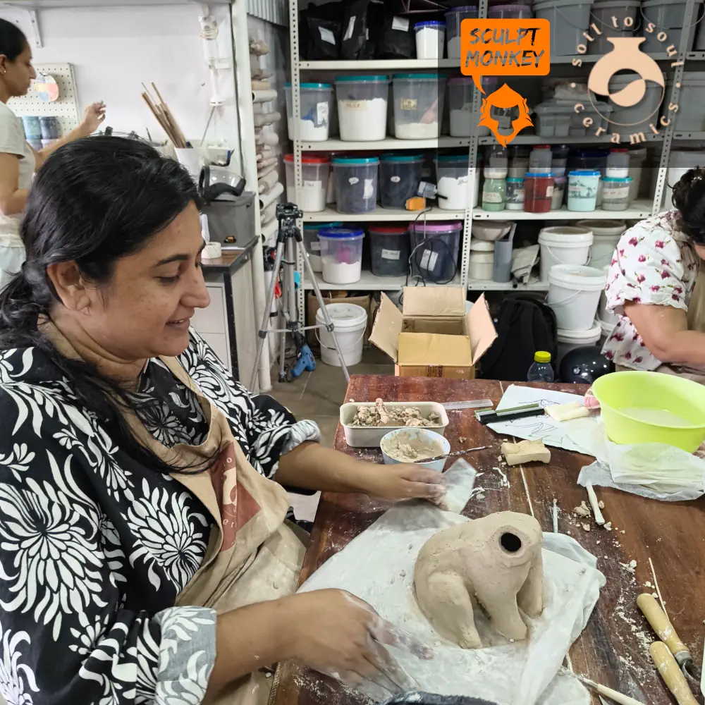 Alia working on her Polar Bear at Soil to Soul Ceramics Animal Sculpting Workshop