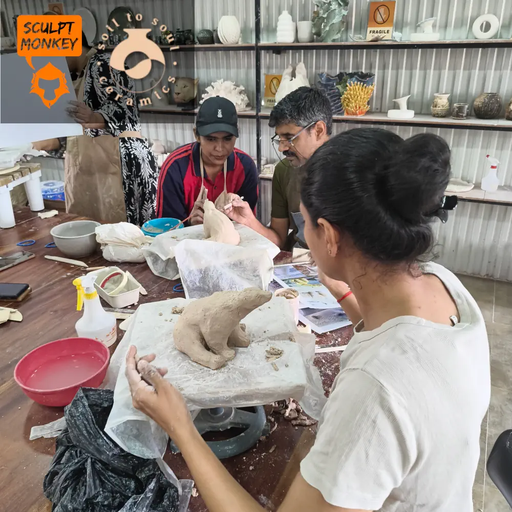 Reema and Rinshida working on their Polar Bear at Soil to Soul Ceramics Animal Sculpting Workshop