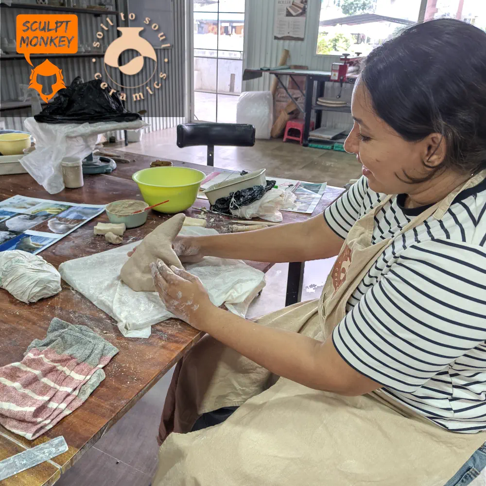Stephy working on her Polar Bear at Soil to Soul Ceramics Animal Sculpting Workshop